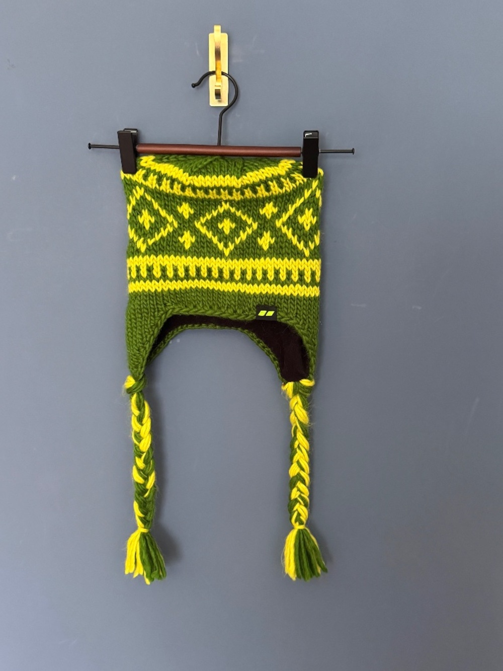 Child's green and yellow Nordic-style wool earflap beanie w/braided side tassels